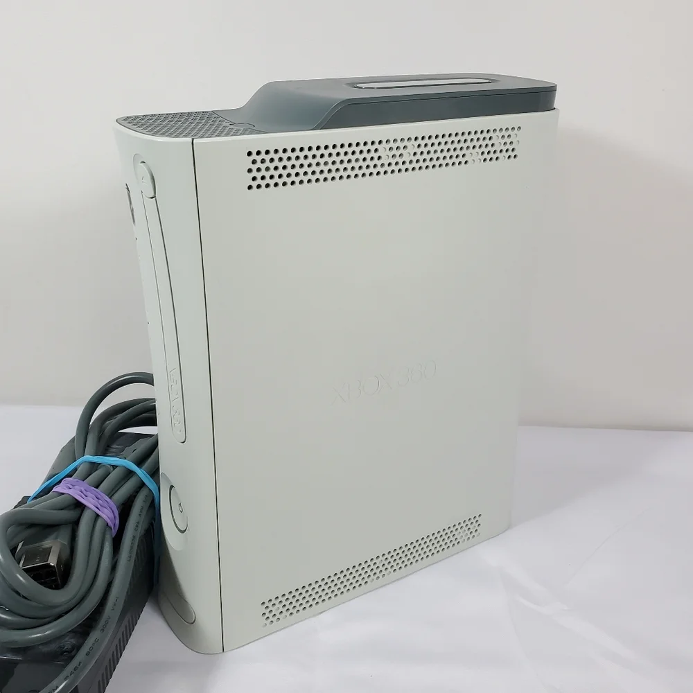 Xbox 360 with 4 games, 2 Controllers Tested Excellent.Condition is Excellent,